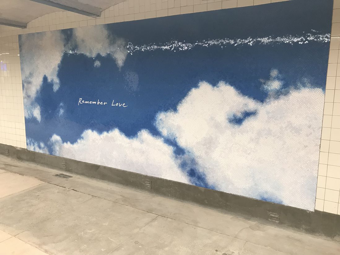 "Remember love" mural on the uptown level  (Jen Chung / Gothamist)
